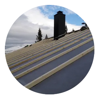 A roof being relaid, battens on the underlay